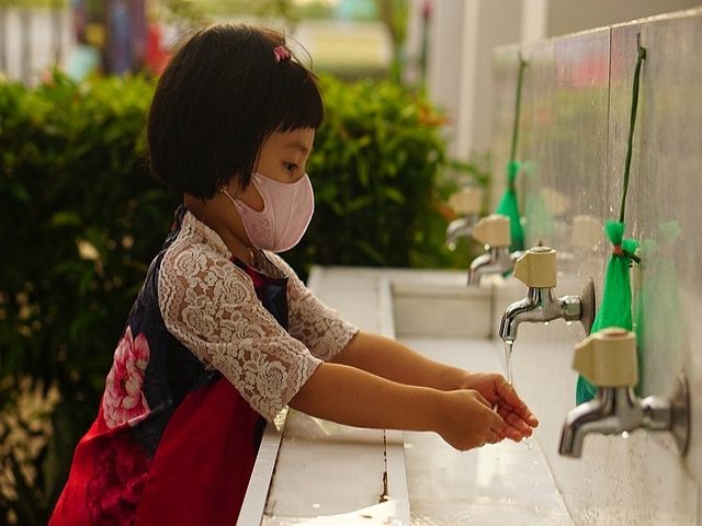 child washing her hands Photo File 640x480
